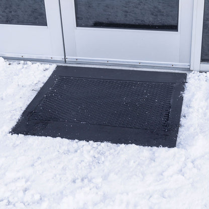 black ice away mat in front of an office building surrounded by snow